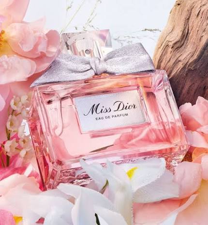 Miss Dior eau de parfum bottle surrounded by flowers