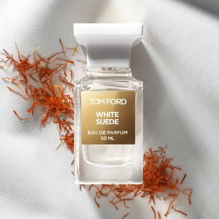Tom Ford White Suede perfume bottle with saffron on a light background
