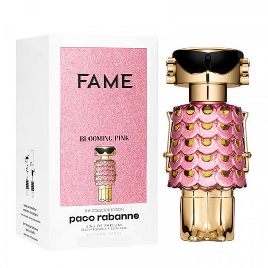 Paco Rabanne FAME Blooming Pink Eau de Parfum bottle next to its white and pink packaging box, featuring a gold and pink snake-scaled design.