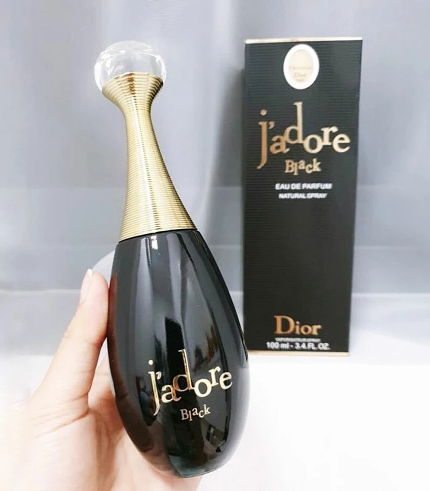 Dior Jadore Black perfume bottle and packaging on a light gray background