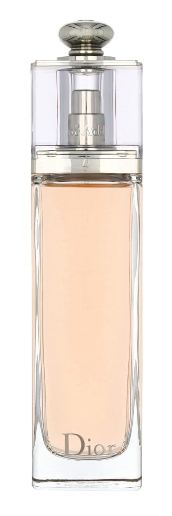 Dior Sauvage Elixir Eau de Toilette bottle with a clear glass body showing a pale peach liquid, a silver spray mechanism, and a silver cap on a white background.