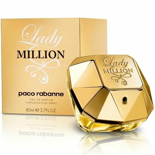 Gold perfume bottle and packaging of Lady Million by Paco Rabanne on a white background