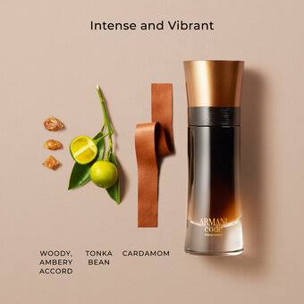 Armani Gold Intense and Vibrant fragrance bottle with a metallic copper cap and dark amber body, styled on a beige background with citrus slices, wood chips, and text describing scent notes.