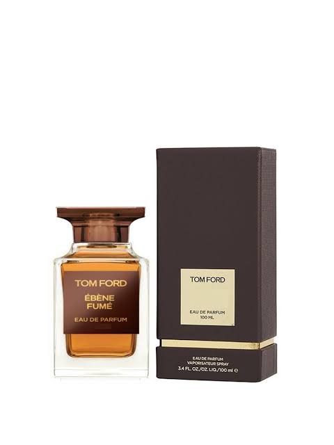 Tom Ford Ébène Pume Eau de Parfum bottle with amber liquid and a dark brown cap, shown next to its dark brown packaging box with a gold label.