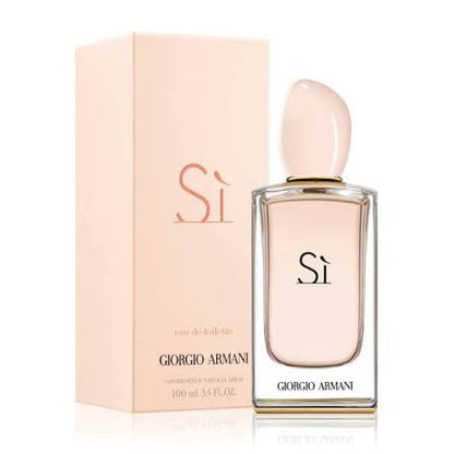 Giorgio Armani Si Eau de Toilette bottle with a pale pink cap and clear glass, standing next to its light pink packaging box on a white background.