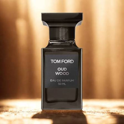 Tom Ford Oud Wood perfume bottle on a warm brown background