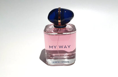 A bottle of Giorgio Armani My Way Eau de Toilette perfume with pink liquid and a dark blue cap, set against a plain white background.